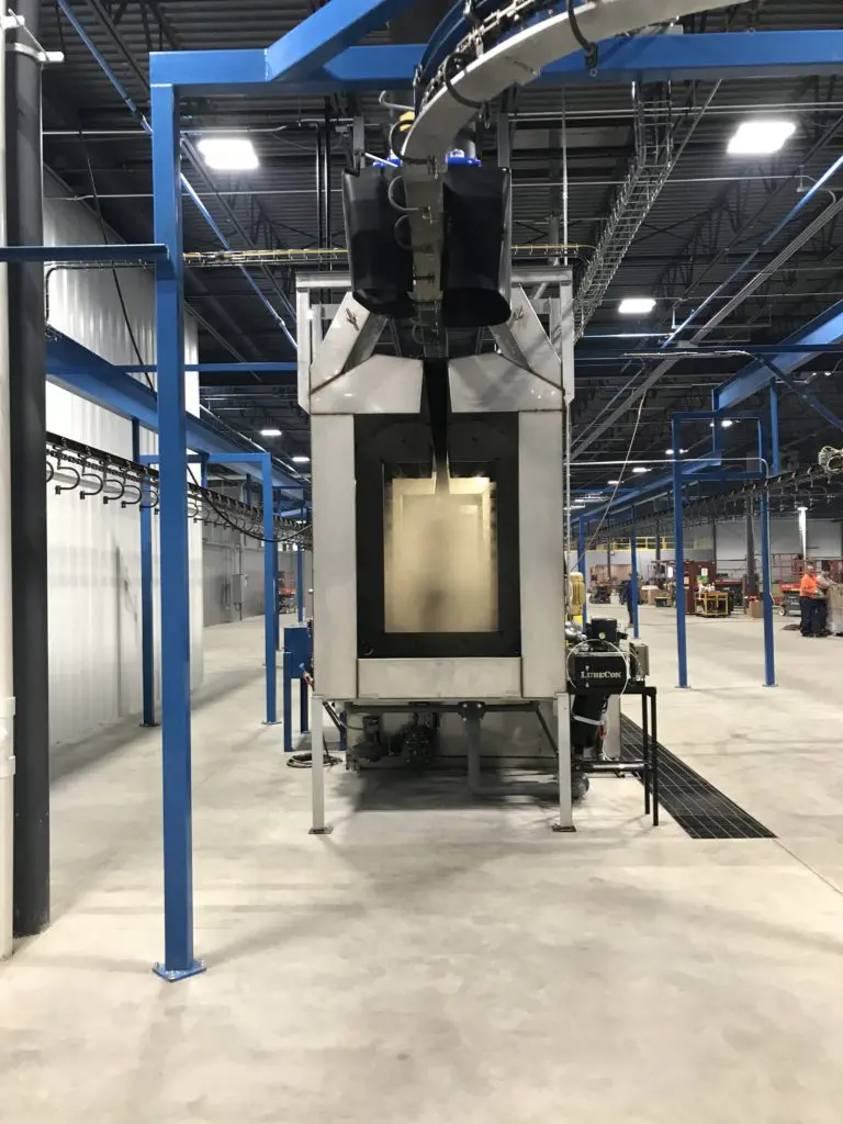 Powered Brush Cleaner going into Powder Coating Oven
