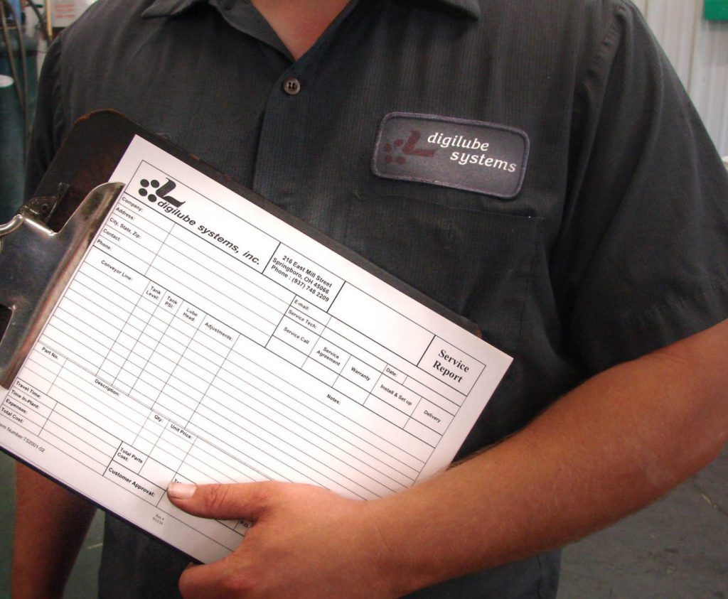 Digilube employee holding an order form